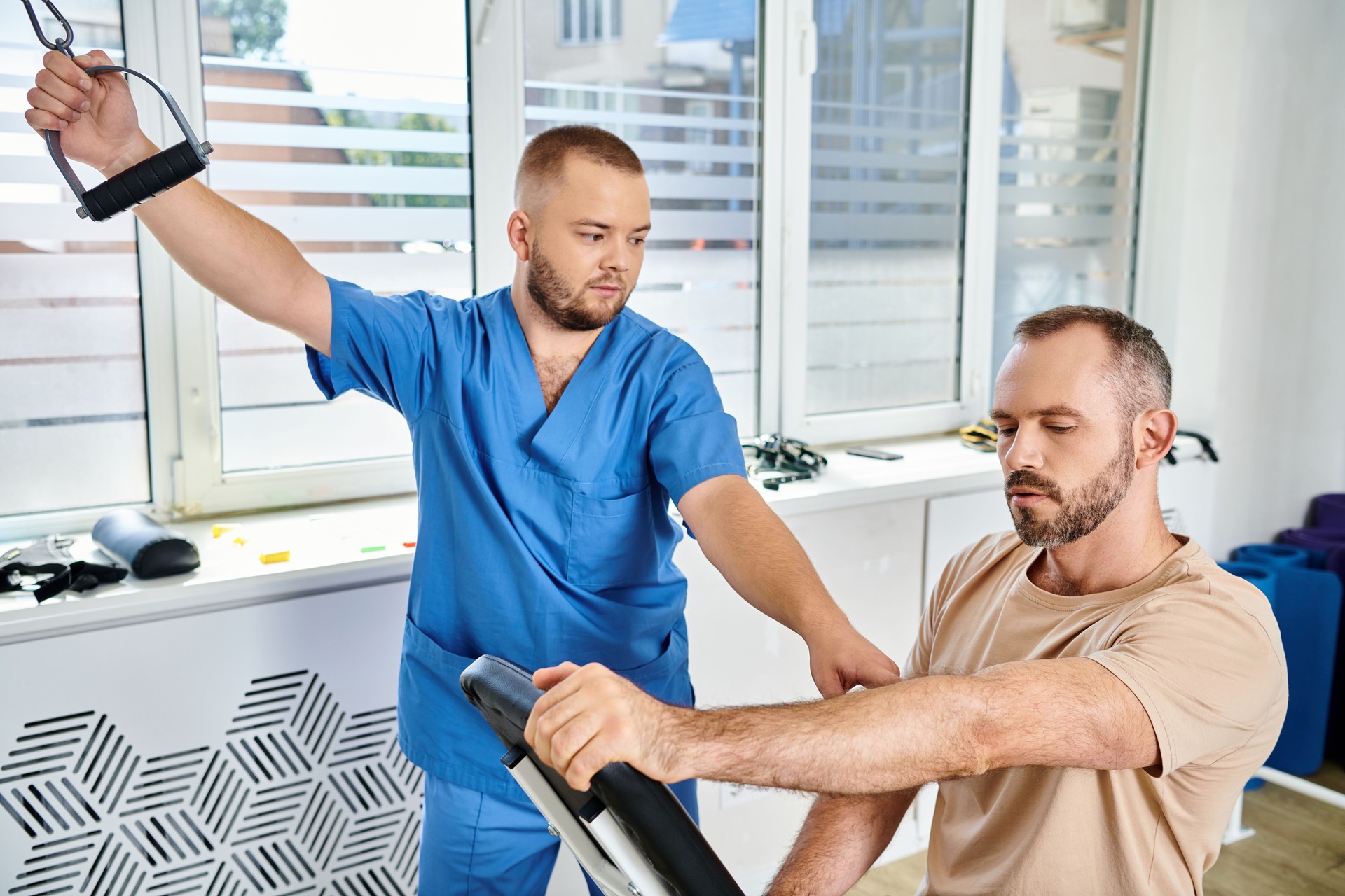 A patient engages in rehabilitation with a doctor at a modern clinic during a wellness session